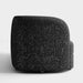 Front facing side view of a contemporary black and metallic boucle curved kidney loveseat on a white background
