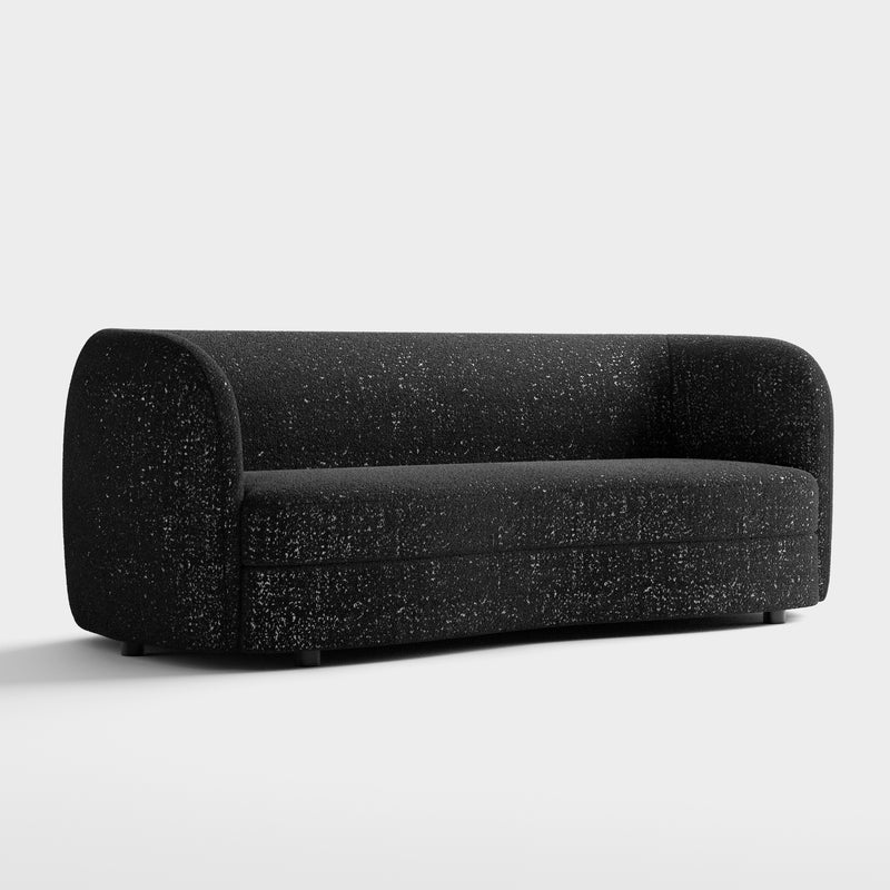 Right facing contemporary black and metallic boucle curved kidney sofa on a white background