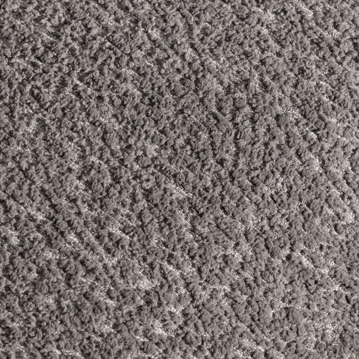 Swatch of the upholstery fabric on a contemporary charcoal gray and metallic boucle curved kidney armchair