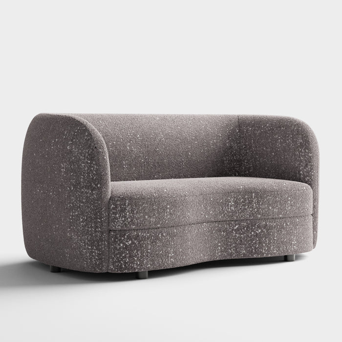 Right facing contemporary charcoal gray and metallic boucle curved kidney loveseat on a white background