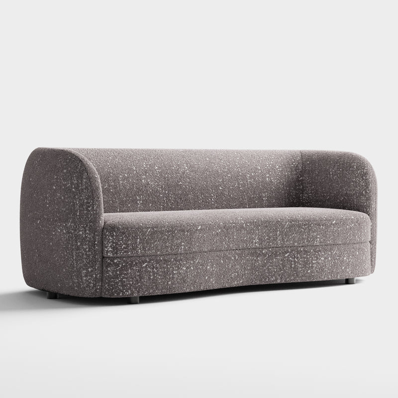 Right facing contemporary charcoal gray and metallic boucle curved kidney sofa on a white background