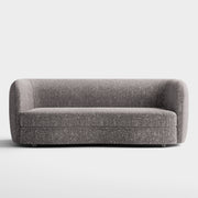 Front facing contemporary charcoal gray and metallic boucle curved kidney sofa on a white background