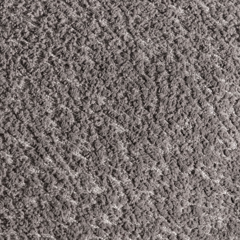 Swatch of the upholstery fabric on a contemporary charcoal gray and metallic boucle curved kidney sofa