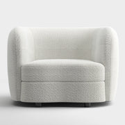 Front facing contemporary off-white metallic boucle curved kidney armchair on a white background