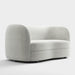 Right facing contemporary off-white metallic boucle curved kidney loveseat on a white background