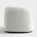 Front facing side view of a contemporary off-white metallic boucle curved kidney loveseat on a white background