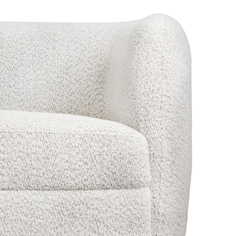 Front facing close up view of the upholstery and armrest on a contemporary off-white metallic boucle curved kidney sofa on a white background
