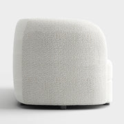 Front facing side view of a contemporary off-white metallic boucle curved kidney sofa on a white background