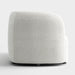 Front facing side view of a contemporary off-white metallic boucle curved kidney sofa on a white background