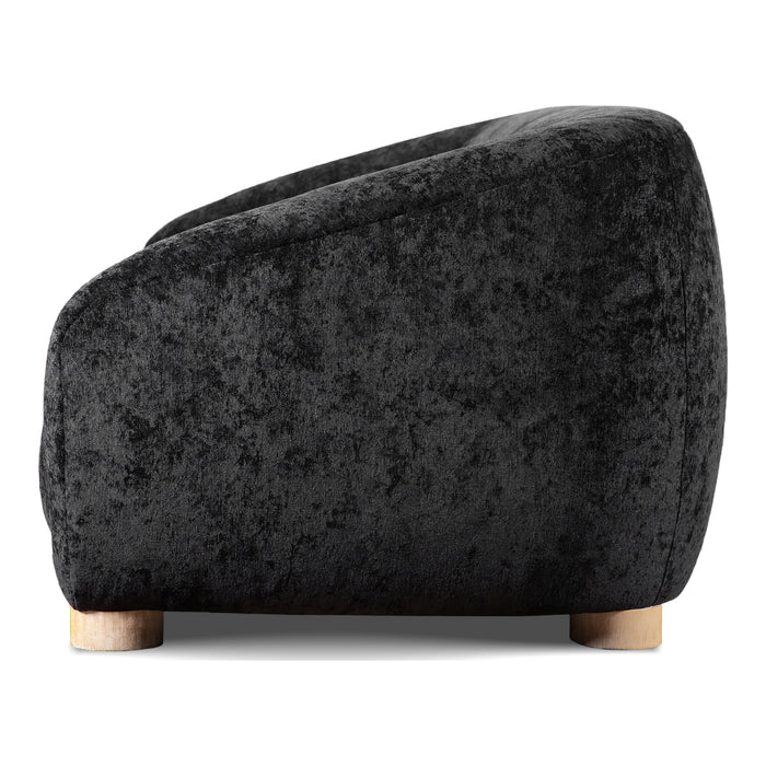 Front facing side view of a contemporary black chenille sloping tuxedo accent armchair on a white background