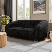 Left facing contemporary black chenille sloping tuxedo loveseat on a white background