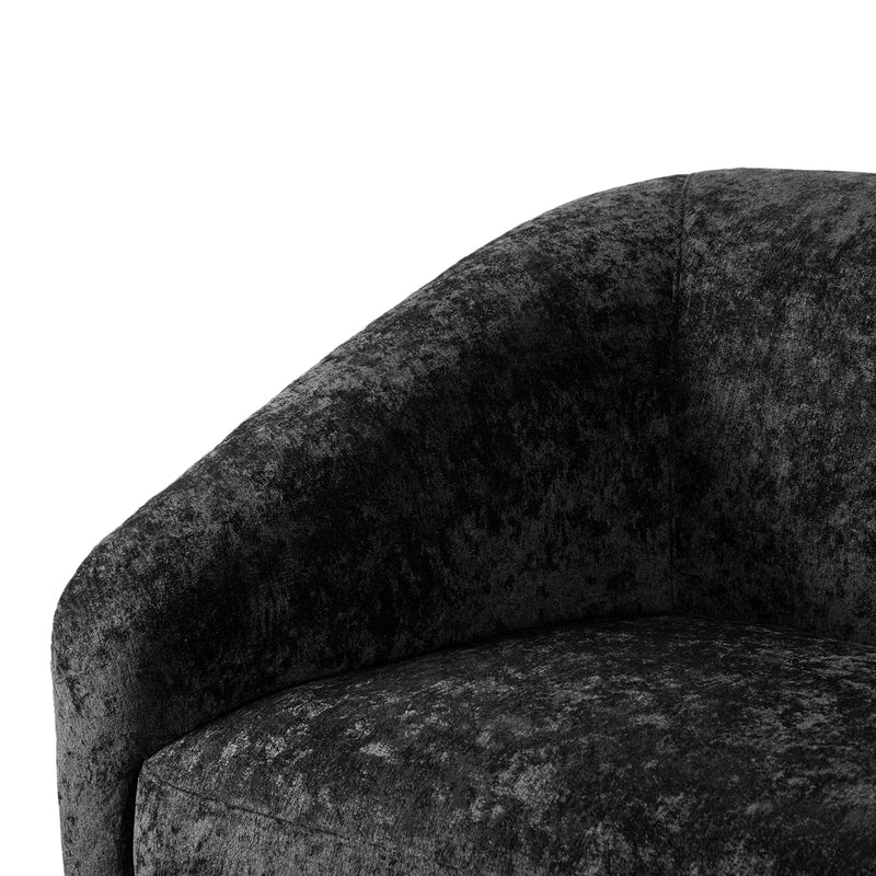 Left facing close up view of the inner armrest on a contemporary black chenille sloping tuxedo loveseat on a white background