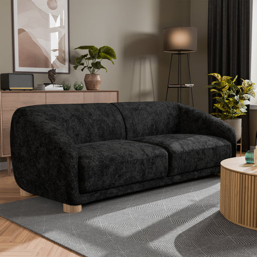 Right facing contemporary black chenille sloping tuxedo accent sofa in a room with accessories