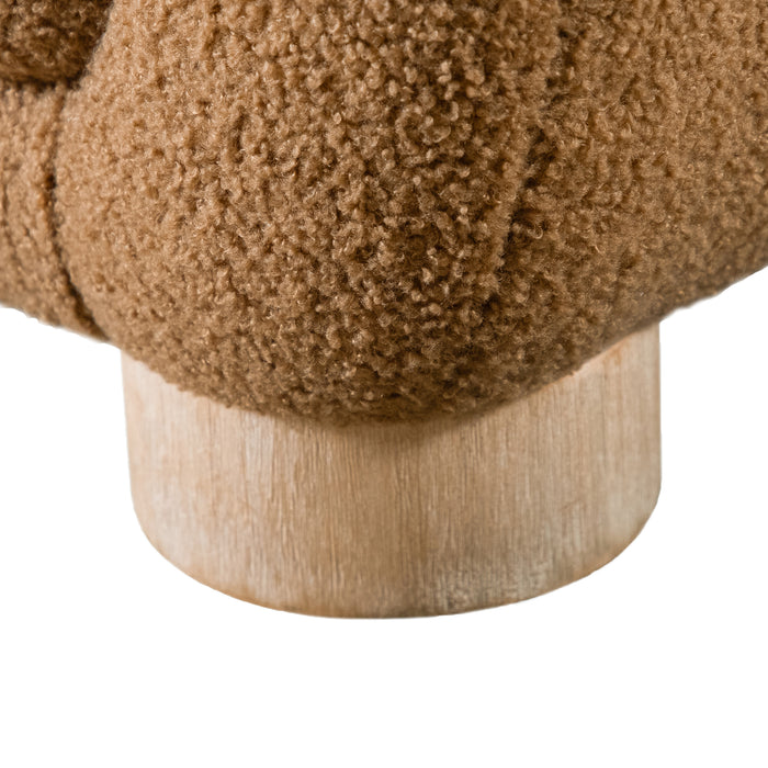 Left facing close up view of the leg on a contemporary brown chenille sloping tuxedo accent armchair on a white background