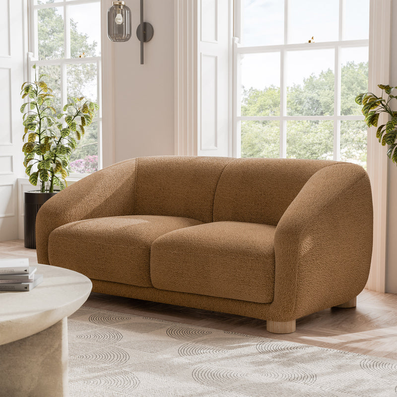 Left facing contemporary brown chenille sloping tuxedo loveseat in a room with accessories