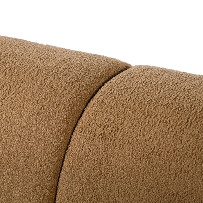 Left facing close up view of the upholstery and backrest on a contemporary brown chenille sloping tuxedo sofa on a white background