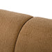 Left facing close up view of the upholstery and backrest on a contemporary brown chenille sloping tuxedo sofa on a white background