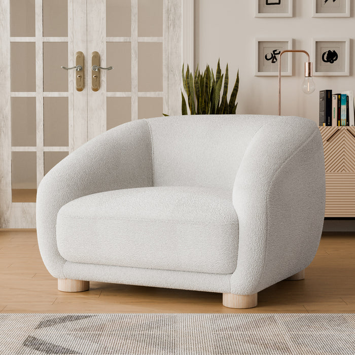 Left facing contemporary white chenille sloping tuxedo accent armchair in a room with accessories