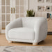Left facing contemporary white chenille sloping tuxedo accent armchair in a room with accessories