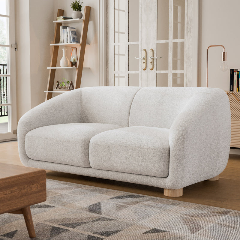 Left facing contemporary white chenille sloping tuxedo loveseat in a room with accessories