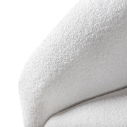 Left facing close up view of the inner armrest on a contemporary brown chenille sloping tuxedo loveseat on a white background