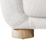 Front facing close up view of the leg on a contemporary brown chenille sloping tuxedo loveseat on a white background