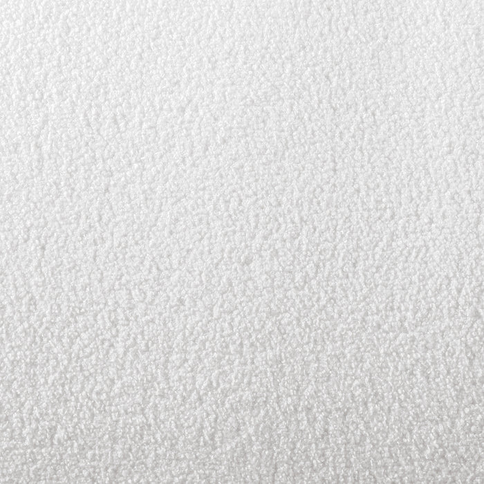 Swatch of the upholstery fabric on a contemporary brown chenille sloping tuxedo sofa