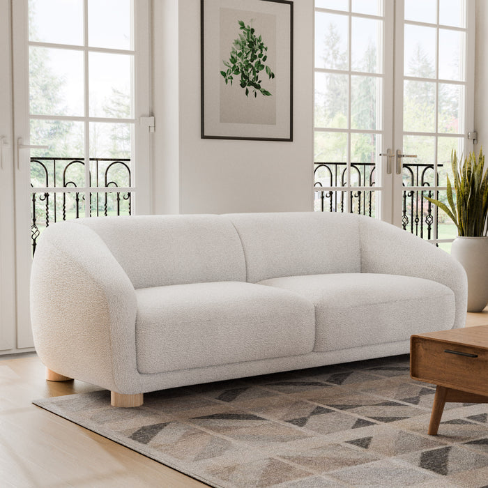 Right facing contemporary white chenille sloping tuxedo sofa in a room with accessories