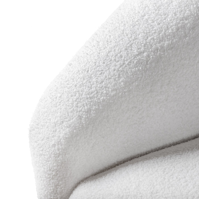 Left facing close up view of the inner armrest on a contemporary brown chenille sloping tuxedo sofa on a white background