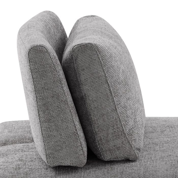 Front facing close up side view of the backrest of a contemporary grey chenille trapezoidal armless chair with an adjustable back on a white background