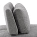 Front facing close up side view of the backrest of a contemporary grey chenille trapezoidal armless chair with an adjustable back on a white background