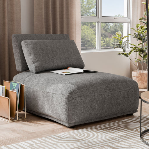 Right facing contemporary grey chenille trapezoidal armless chair with an adjustable back in a room with accessories