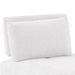 Right facing close up of the back of a contemporary white chenille trapezoidal armless chair with an adjustable back on a white background
