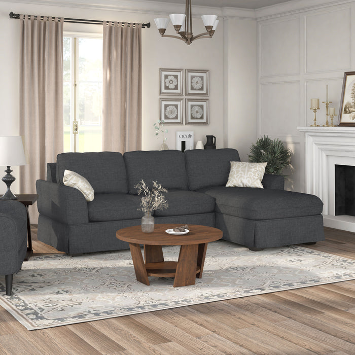 Right-angled transitional sectional sofa with right-facing chaise, flared arms and skirted base in a living room