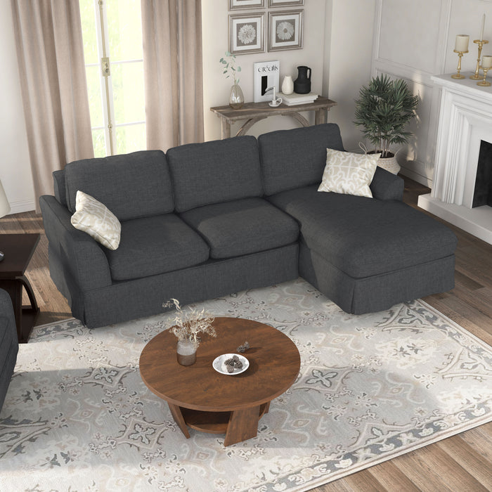 Top view of transitional sectional sofa with right-facing chaise, flared arms and skirted base in a living room