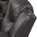 Left facing close up of the backrest of a transitional dark grey faux leather reclining sectional sofa with a storage console on a white background