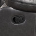 Front facing close up of the manual recline lever of a transitional dark grey faux leather reclining sectional sofa with a storage console