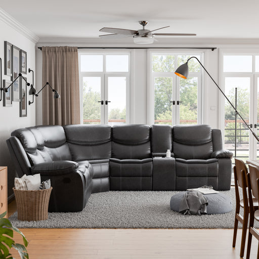 Front facing transitional dark grey faux leather reclining sectional sofa with a storage console in a room with accessories