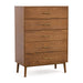Right facing mid-century modern walnut finish five-drawer chest on a white background