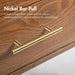 Informational image of the nickel bar pulls of a mid-century modern walnut finish five-drawer chest