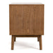 Front facing side view of a mid-century modern walnut finish two-drawer nightstand on a white background