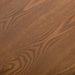 Swatch of the walnut wood grain veneer of a mid-century modern walnut finish queen bed