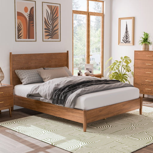 Right facing mid-century modern walnut finish queen bed in a room with accessories