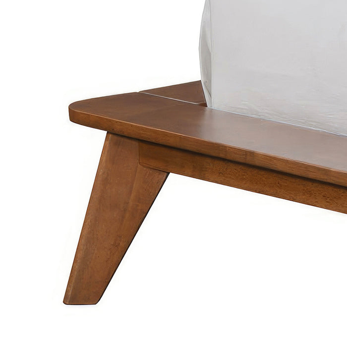 Left facing close up view of the rails and leg on a mid-century modern walnut finish rounded corner queen bed on a white background