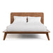 Front facing mid-century modern walnut finish rounded corner queen bed on a white background