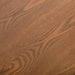 Swatch of the walnut wood grain veneer of a mid-century modern walnut finish rounded corner queen bed