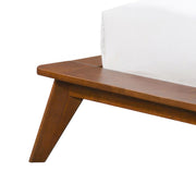 Left facing close up view of the rails and leg on a mid-century modern walnut and beige boucle wingback queen bed on a white background