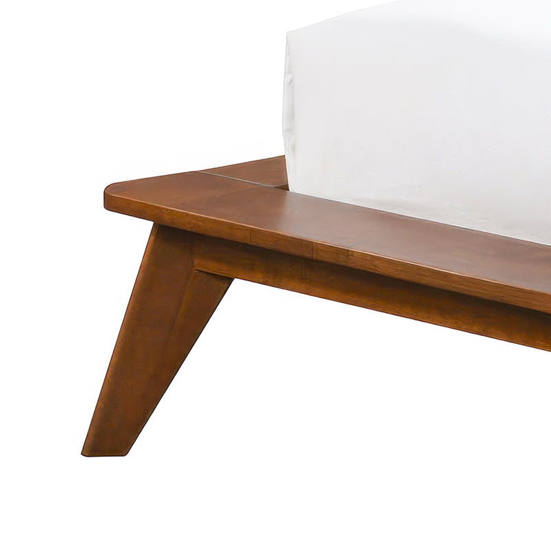 Left facing close up view of the rails and leg on a mid-century modern walnut and beige boucle wingback queen bed on a white background