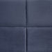 Swatch view of the upholstery and tufting on a contemporary grey upholstered full bed with attached storage bench