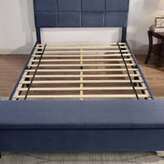 Front facing contemporary grey upholstered full bed with attached storage bench in a room with accessories